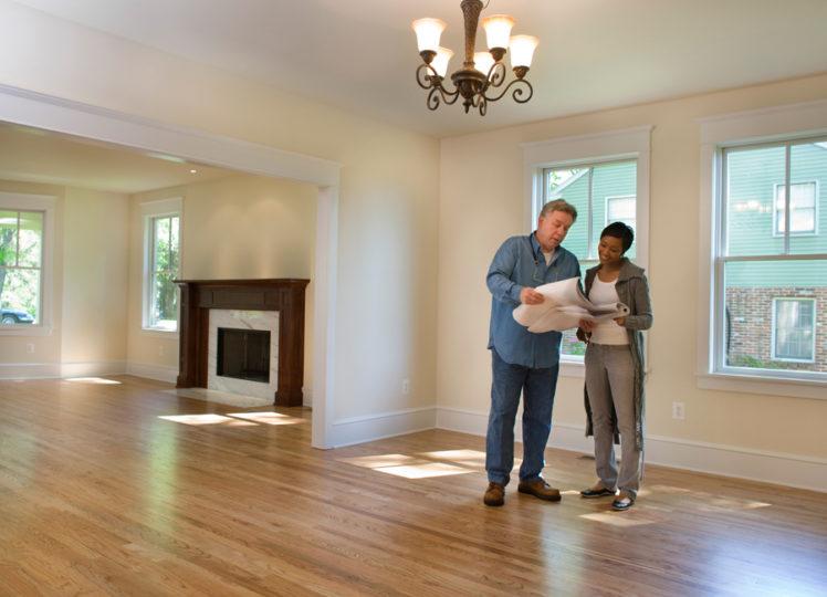 reviewing blueprints in new home