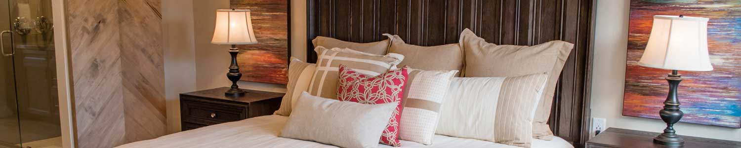 barn door with artistic wood pattern entry to master bathroom from master bedroom